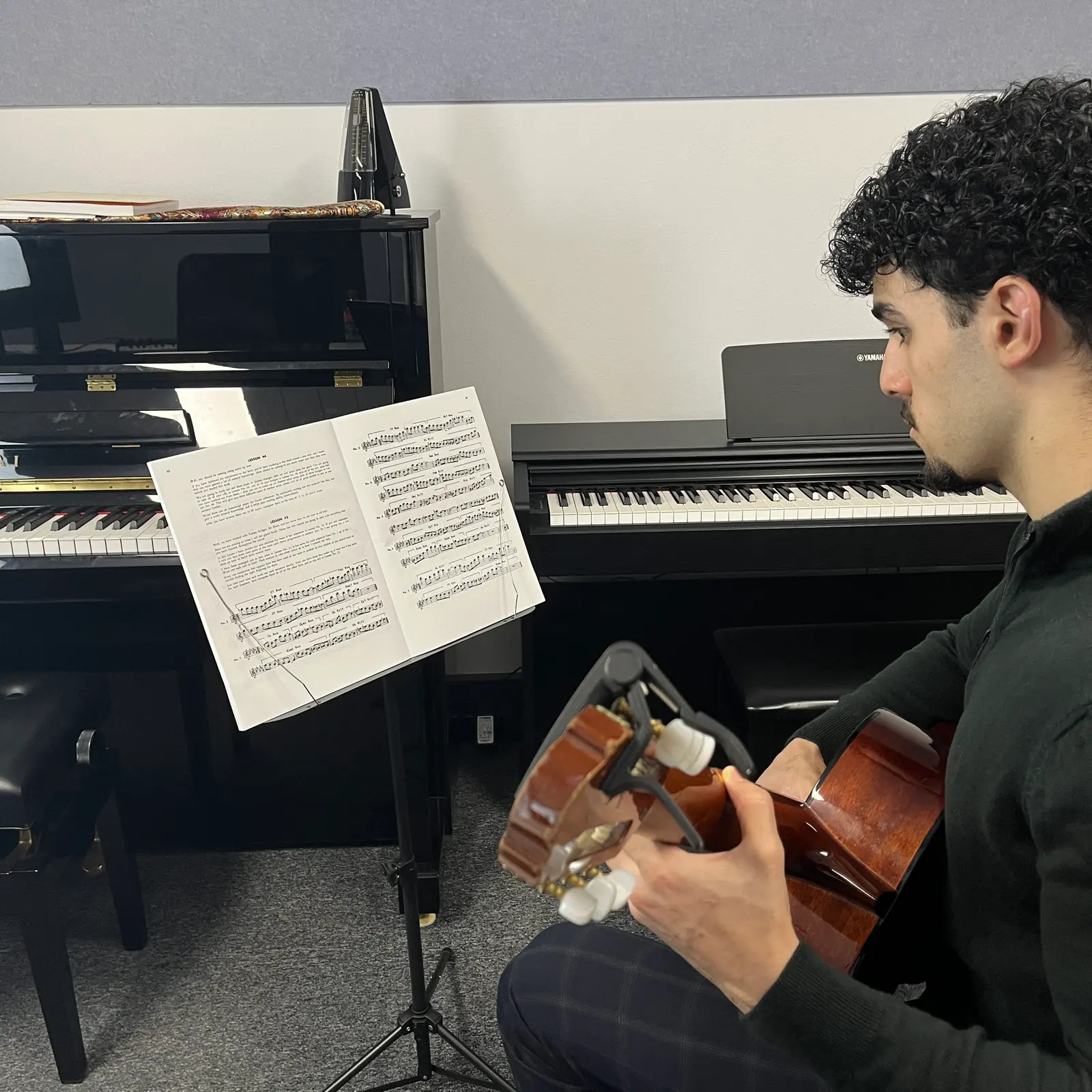 Guitar teacher and student