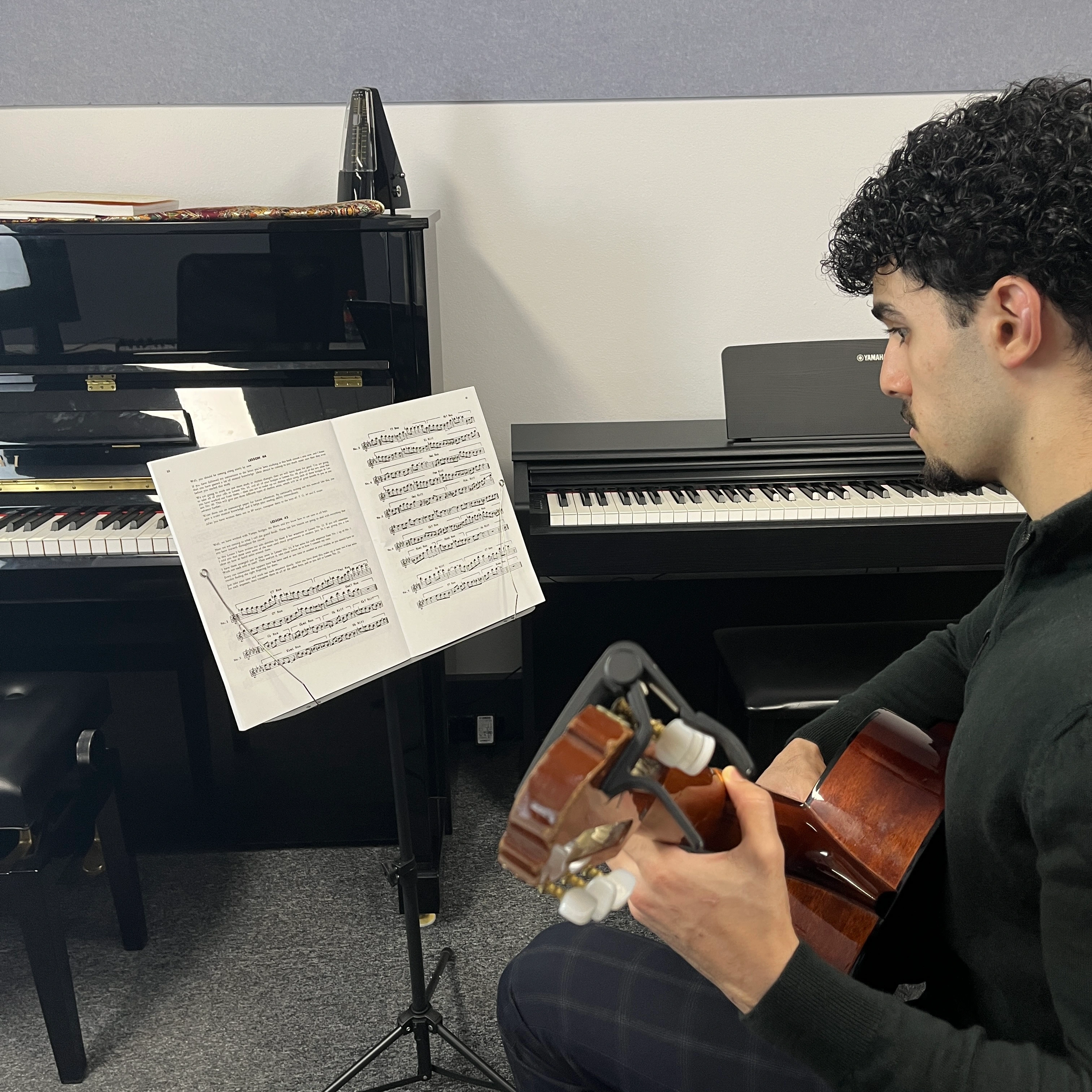 Guitar teacher and student