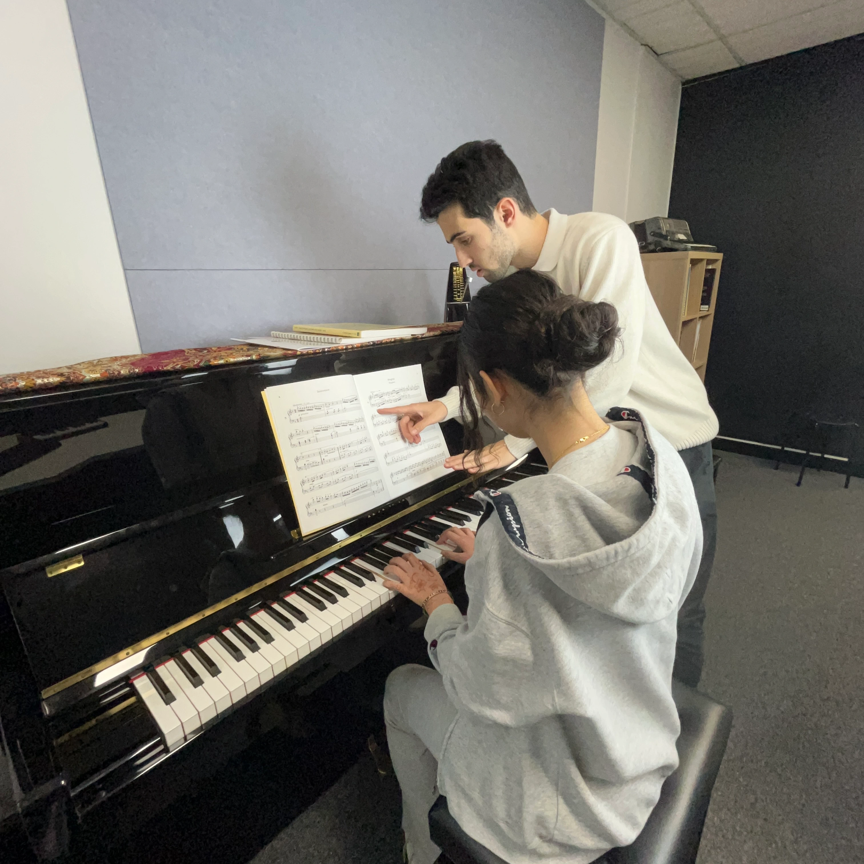 Piano teacher and student